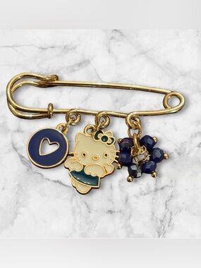 Hello Kitty Gold Safety Pin Charm with Navy Accents